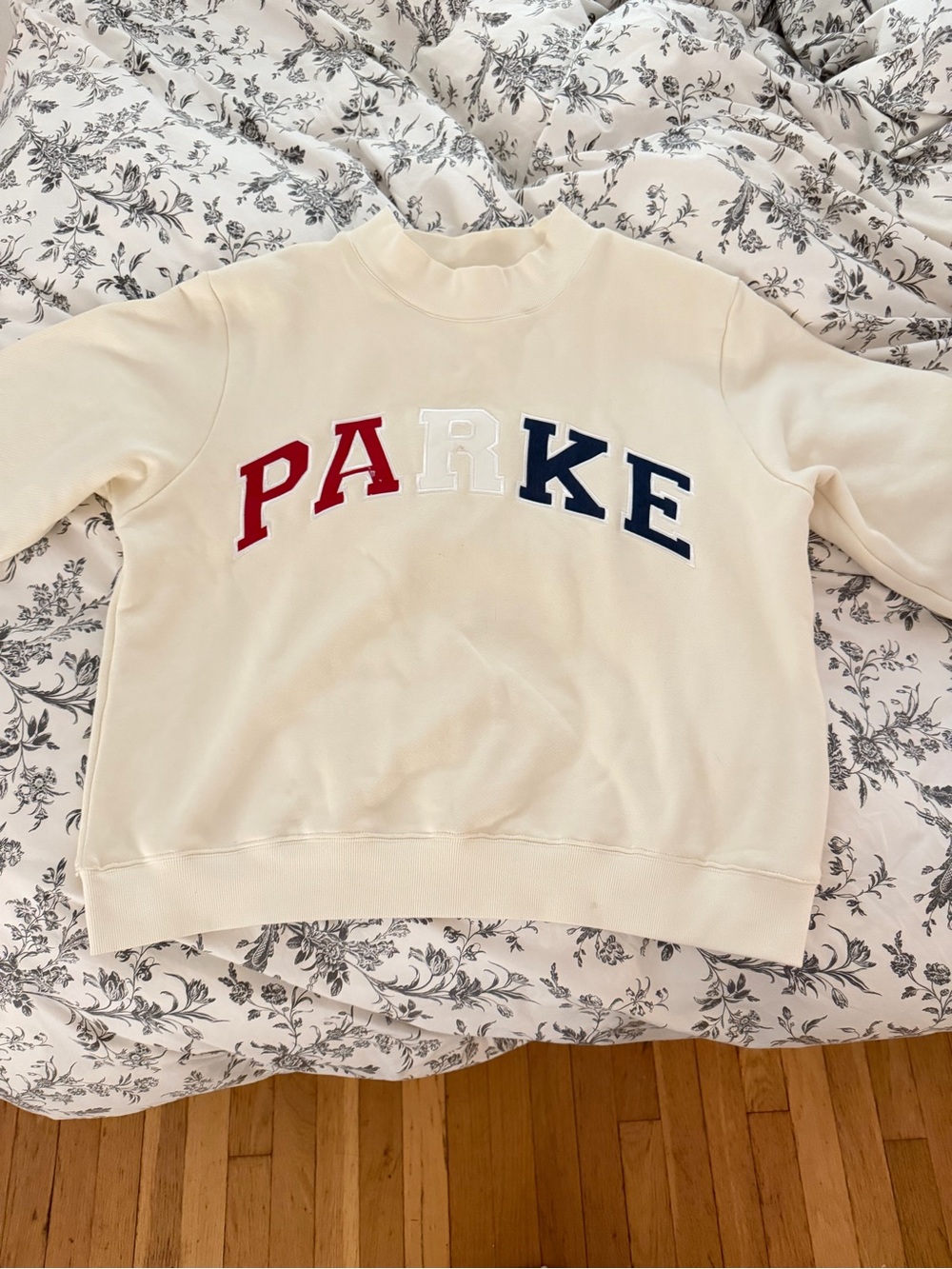 Parke Cream Sweatshirt with Navy red and white logo